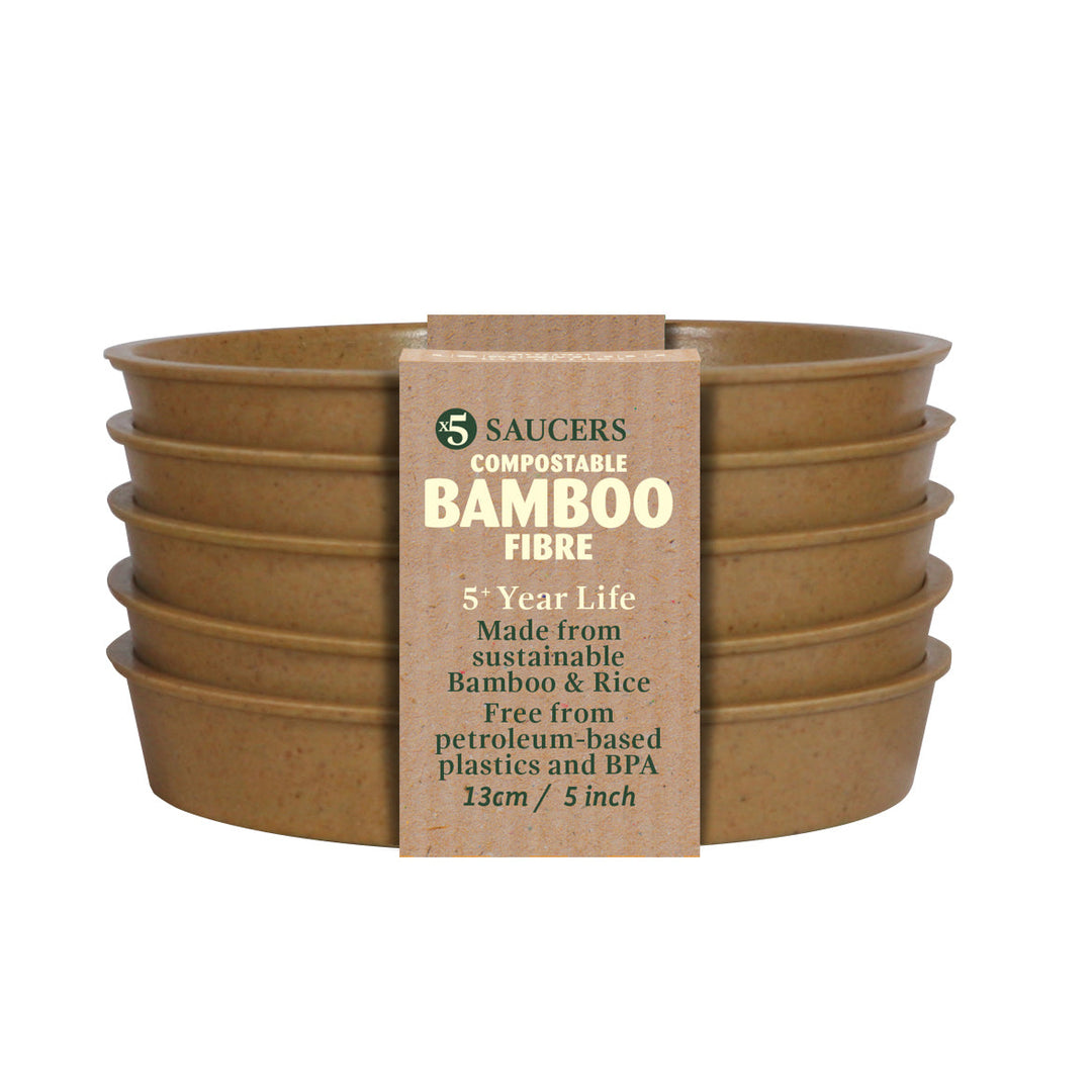 Set of five compostable bamboo fibre saucers with a label on a white background